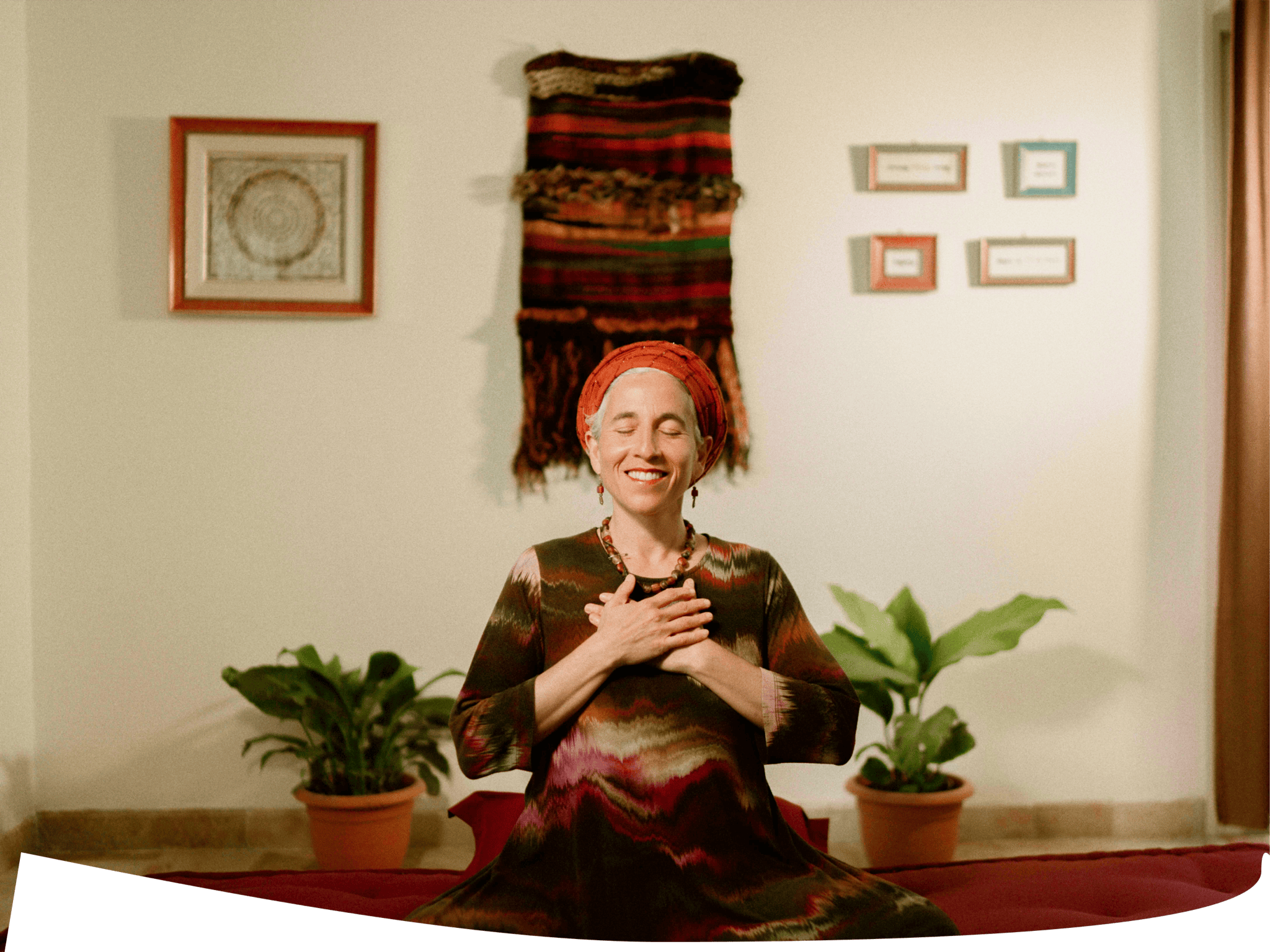 Chana Mason seated in meditation with hands on heart